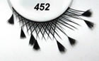 Feathered Tips crisscross false eyelashes fashioned for style and drama.