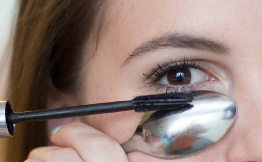 hold a spoon underneath your eye on your lower lashes for this...