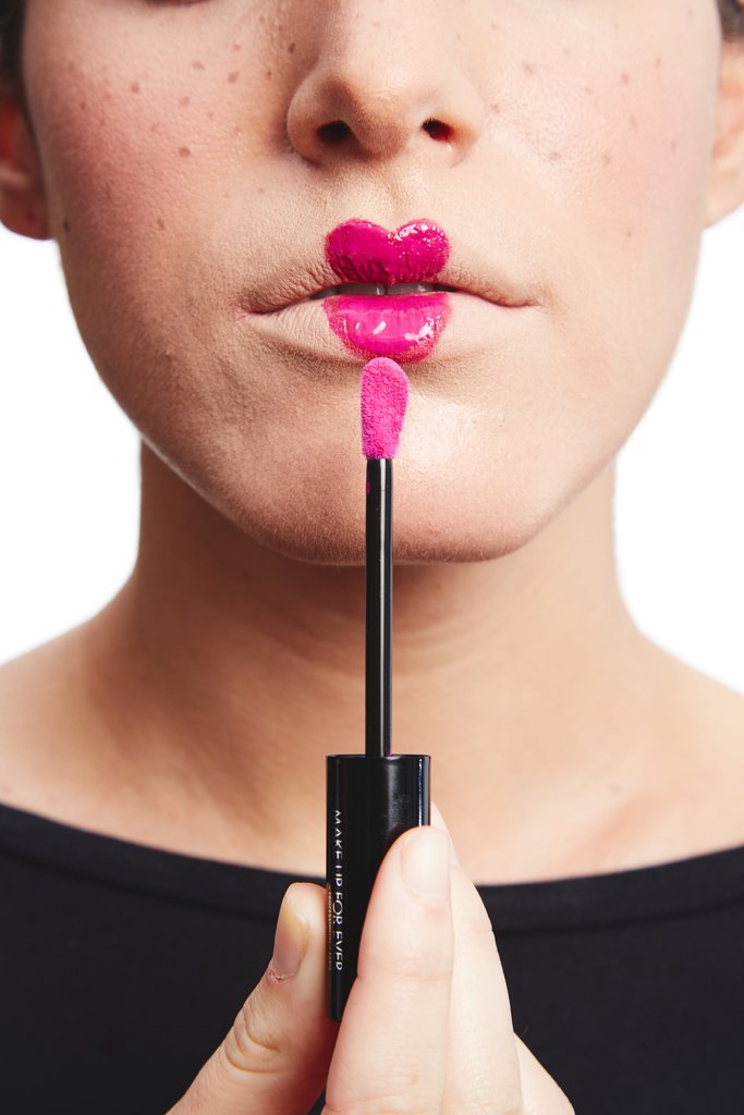 Layer on a high-shine lip gloss.