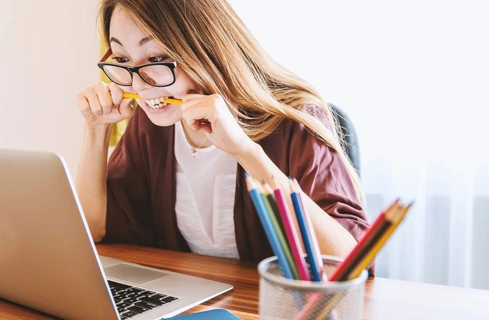 laptop; woman; education; study; young; stressed